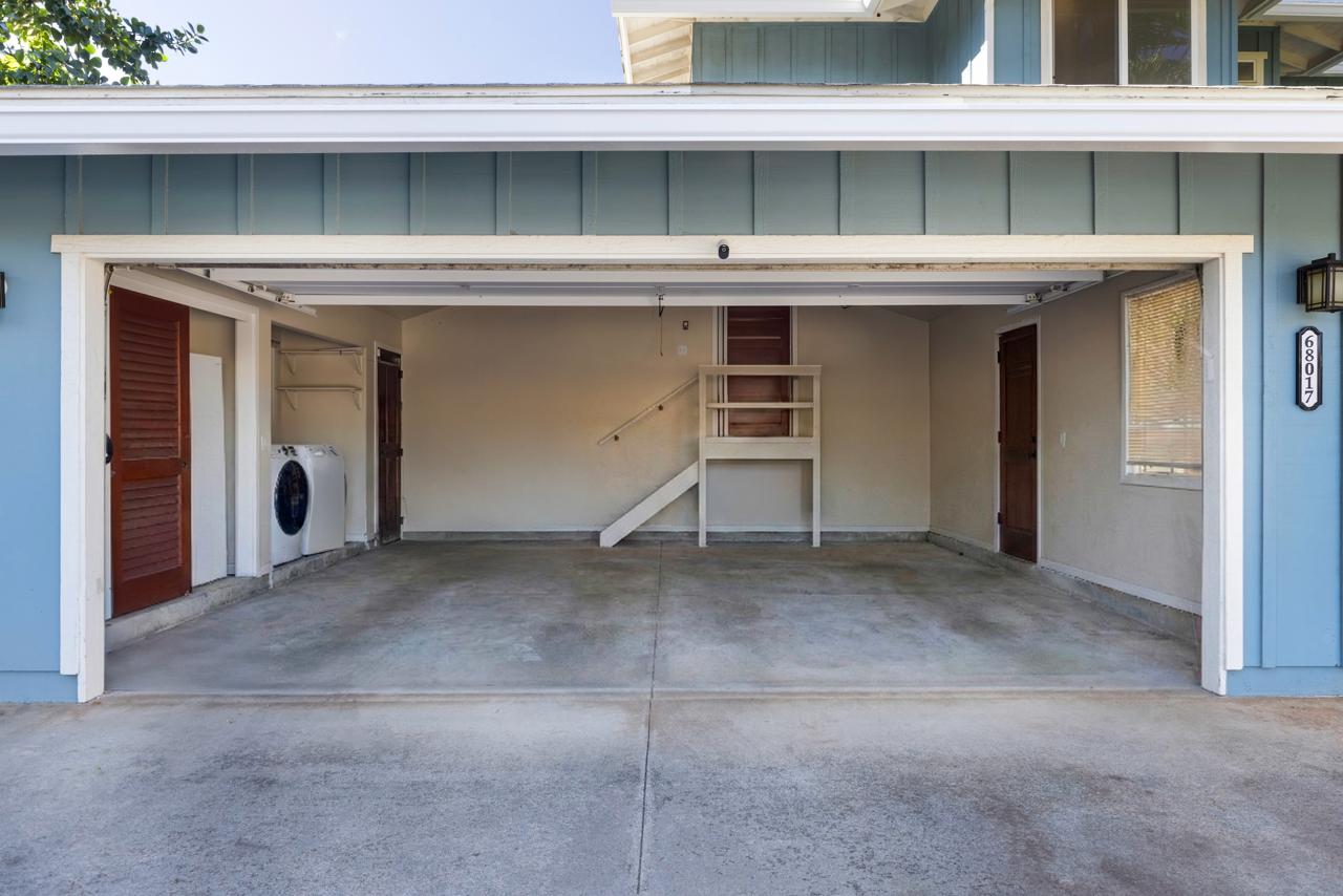 The Main House open garage and laundry area